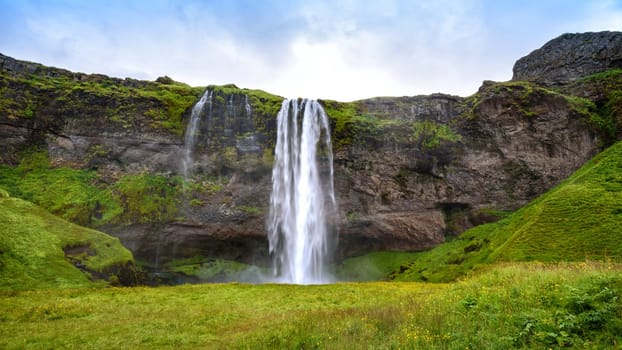 view of beautiful waterfall Seljalandsfoss in summer, south Iceland