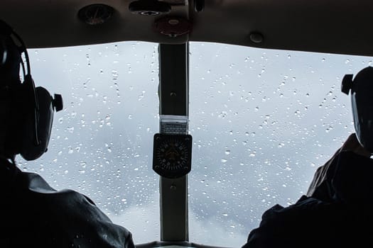 inside airplane cabin pilot rainy fly