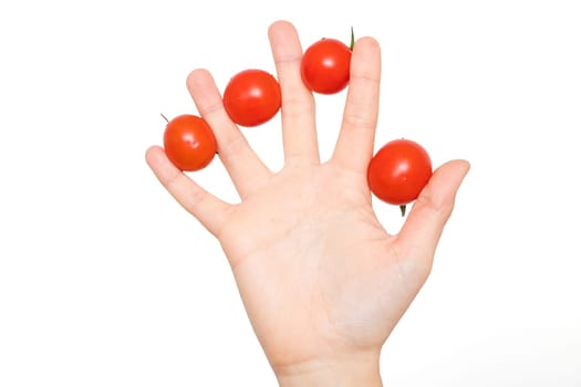 Woman hand with tomatoes between her fingers