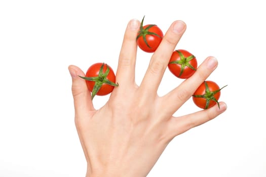 Woman hand with tomatoes between her fingers