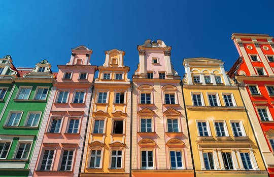 Colorful houses on Market square, Wroclaw, Poland. Townhouses in medieval market square, rynek. City centre, ancient homes. Tenement houses, popular landmark. Famous Wroclaw Old Town, Lower Silesia