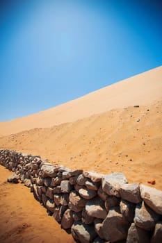 Sands dunes in the desert and blue sky.