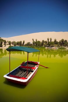 Oasis surrounded by sand dunes near Ica Peru