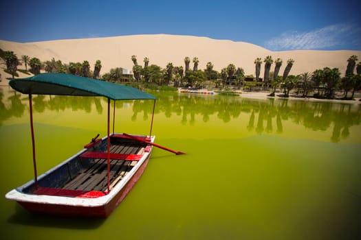 Oasis surrounded by sand dunes near Ica Peru