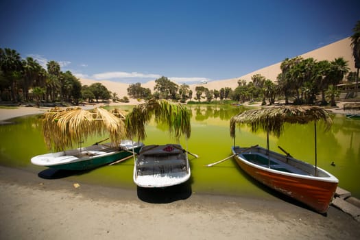 Oasis surrounded by sand dunes near Ica Peru