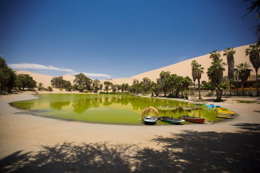 Oasis surrounded by sand dunes near Ica Peru