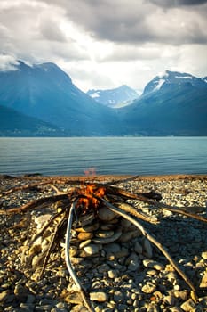 Inviting campfire on the beach during the summer