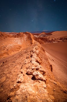 night sky. Amphitheatre is beautiful geological formation of Moon Valley in Atacama Desert, Chile