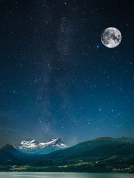 stars shine in the sky over the fjords. Milky Way