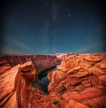 Grand Canyon at night under the light of the stars in the sky