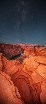Grand Canyon at night under the light of the stars in the sky