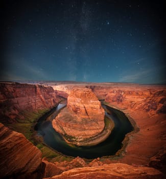 Grand Canyon at night under the light of the stars in the sky