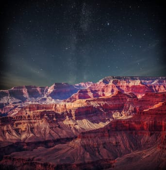 Grand Canyon at night under the light of the stars in the sky