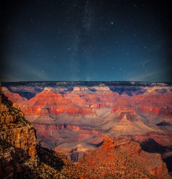 Grand Canyon at night under the light of the stars in the sky