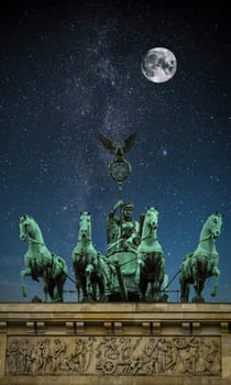 Brandenburg Gate night. Under the light of the stars the Milky Way galaxy