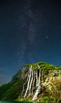 stars shine in the sky over the fjords. Milky Way