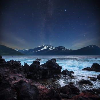 stars shine in the sky over the fjords. Milky Way