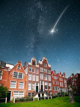 At night, under the light of stars. falling star. Amsterdam. historical monument begijnhof