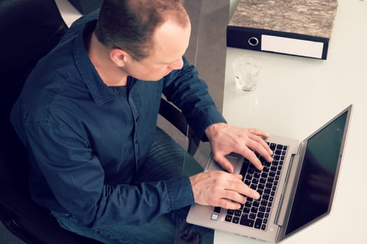 young business man at his desk working with computer