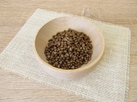 Grape seeds in a wooden bowl,Vitis viniferae semen