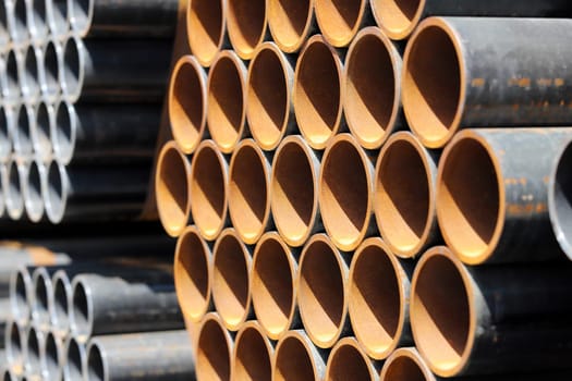 Stack of steel pipes industrial background