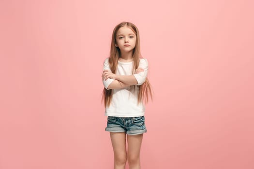 Serious, sad, doubtful, thoughtful teen girl atanding at studio. Human emotions, facial expression concept