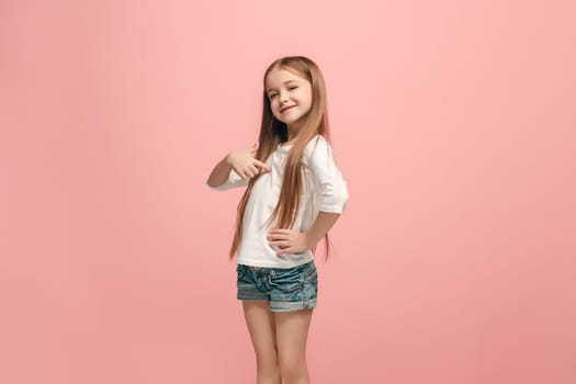 I won. Winning success happy teen girl celebrating being a winner. Dynamic image of caucasian female model on pink studio background. Victory, delight concept. Human facial emotions concept. Trendy colors
