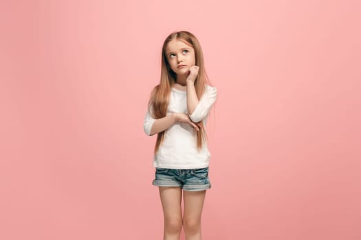 Serious, sad, doubtful, thoughtful teen girl atanding at studio. Human emotions, facial expression concept