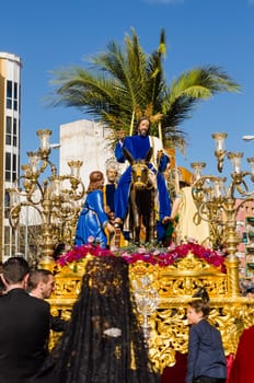 BADAJOZ, SPAIN - MARCH 26, 2018: Image of Jesus riding a donkey, during the celebration of Palm Sunday.