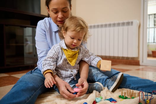 A mother and her toddler playing together at home, sharing moments of joy and connection during their daytime activities.