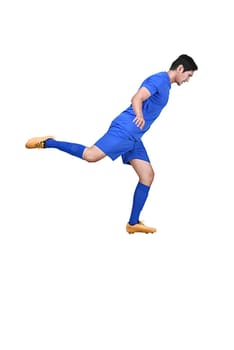 Side view of asian football player kicking the ball posing isolated over white background