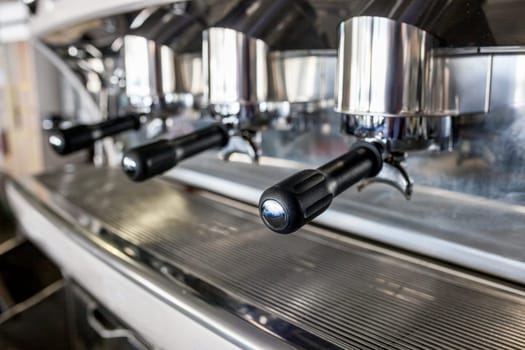 Holders on new vintage bar coffee machine. Selective focus
