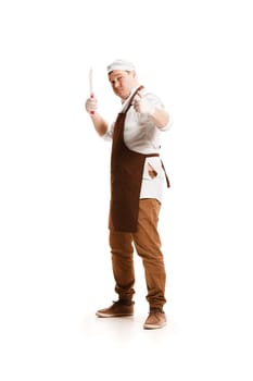 Smiling happy butcher posing with a cleaver isolated on white studio background with sign ok. The young caucasian male model in full-length. Butcher, knife, professional concept