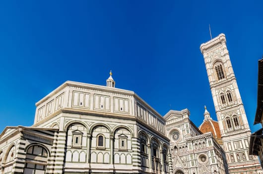 Famous Santa Maria del Fiore cathedral church with Baptistery in Florence. View from below