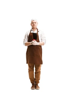 Smiling butcher posing with a cleaver isolated on white studio background. The young caucasian male model in full-length. Butcher, knife, professional concept