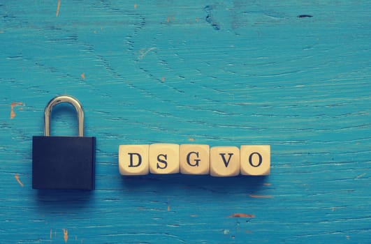 DSGVO concept image with small wooden dices on a wooden background