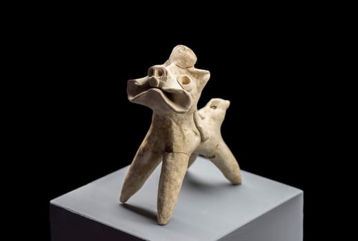 Jaen, Spain - December 29th, 2017: Clay animal-shaped whistle figurine made of clay. Jaen Museum