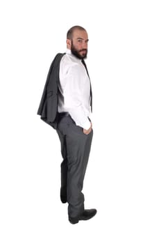 A young handsome business man standing in profile and looking over.his shoulder, with his jacket over his shoulder, isolated over white.