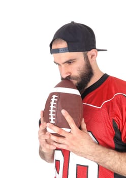 A close-up image of a football player in his jersey, holding his football.to his mouth, thinking, isolated for white background.