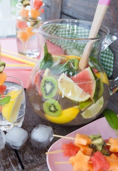Homemade lemonade with fresh colorful fruits