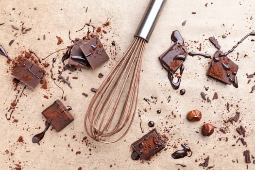 Delicious dark chocolate pieces with cocoa powder