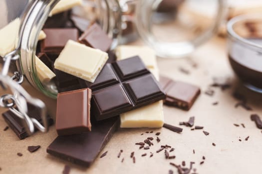 Variety of delicious chocolate bars in a jar