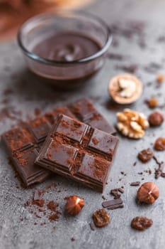 Delicious chocolate on a rustic grey background