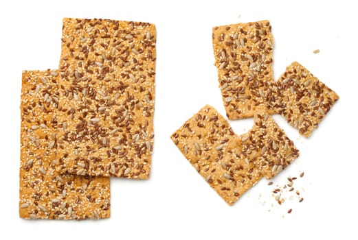 crisp bread with linseed,sesame and sunflower seed isolated on white background. top view