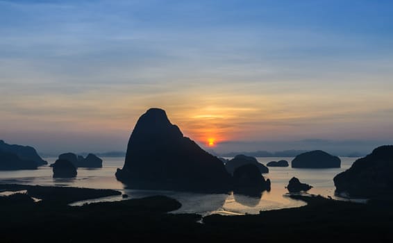 Panorama of limestone karsts in Phang nga bay at sunrise. Unseen place of "Samed Nangshe"" or ""Samet Nangchee"" in Phang Nga province, Thailand."