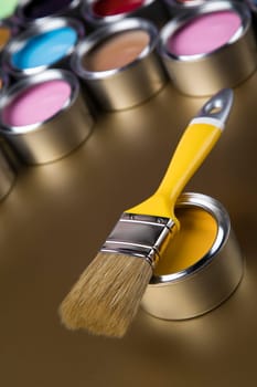 Colorful paint cans with paintbrush