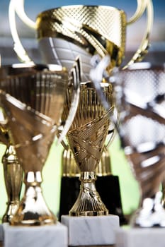 Award winning and championship concept, trophy cup on sport background