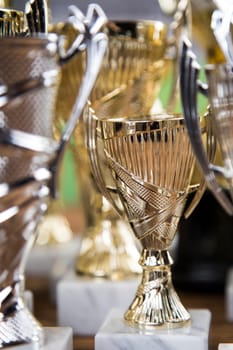 Award winning and championship concept, trophy cup on sport background