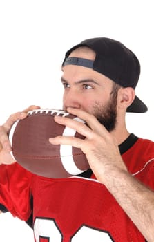 A close-up image of a football player in his jersey, holding his football.to his mouth, thinking, isolated for white background.