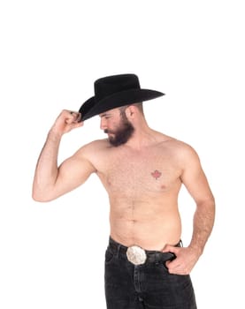 Young man standing shirtless, wearing a black cowboy hat and black.jeans with his muscular body, isolated for white background.